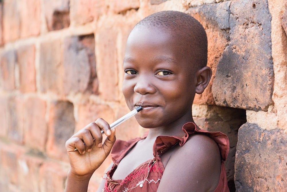 What is a feeding scheme and how does it help learners and schools girls